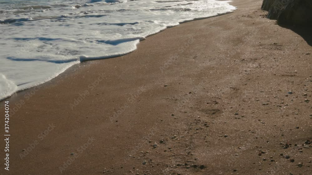 Сame lapping in the bay and leave shells and foam Сame lapping in the bay and leave shells and foam