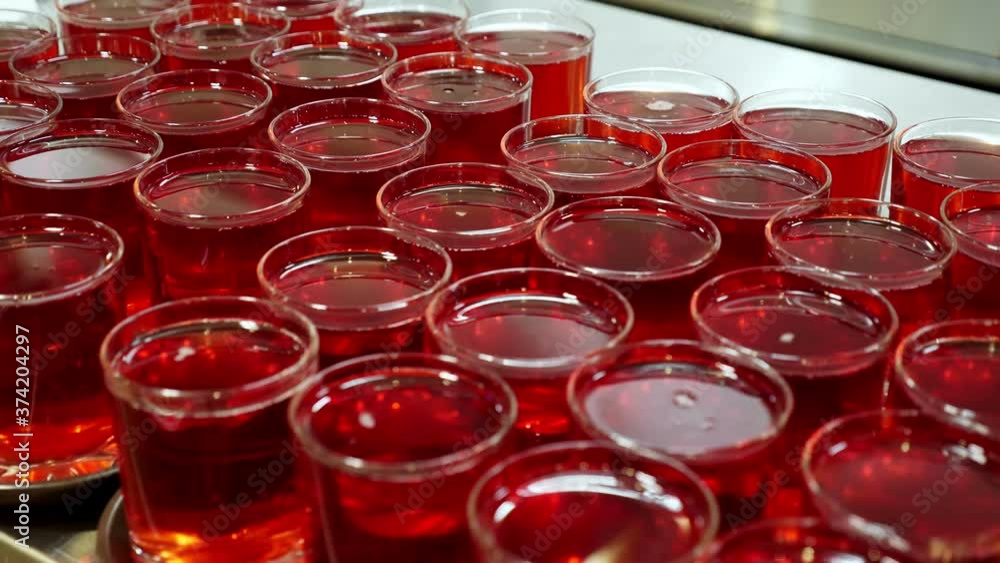 close-up. glasses with fruit red drink, juice on display showcase of self-service cafeteria or buffet restaurant. health food. reopening . safety concept. volunteering and charity. close-up. glasses with fruit red drink, juice on display showcase of self-service cafeteria or buffet restaurant. health food. reopening . safety concept. volunteering and charity.