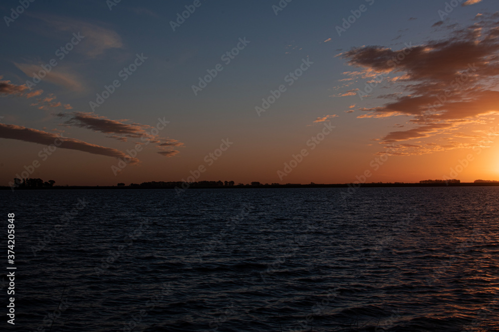 Naklejka premium Sunset Over the Lake