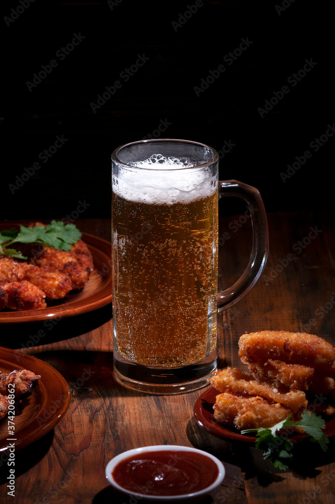 Frothy cool beer with a snack. Frothy cool beer with a snack.