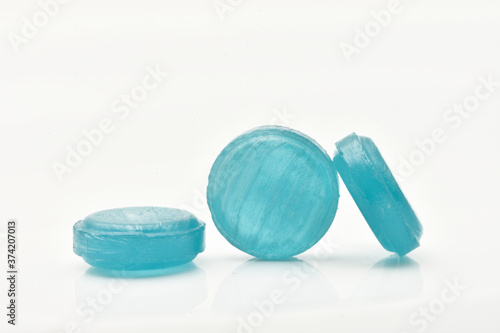 Medical  red lozenges for relief cough, sore throat and throat irritation isolated on white background.