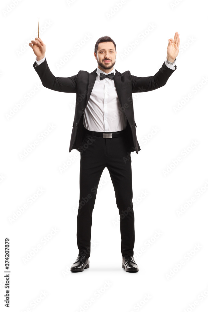 Full length portrait of a male musical conductor starting a show Full length portrait of a male musical conductor starting a show