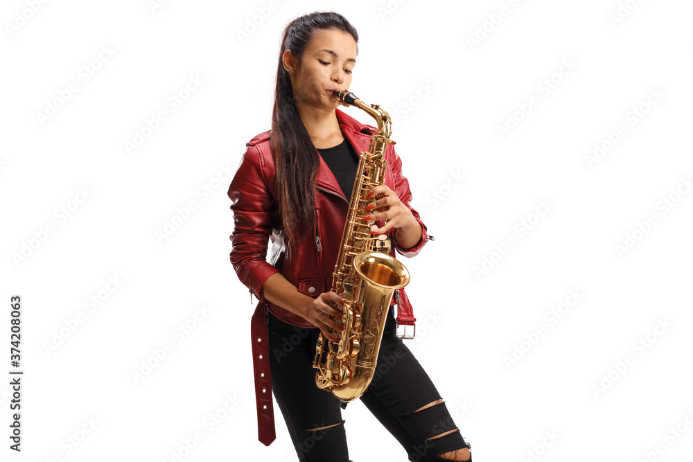Naklejka premium Young female saxophonist in a red leather jacket playing sax