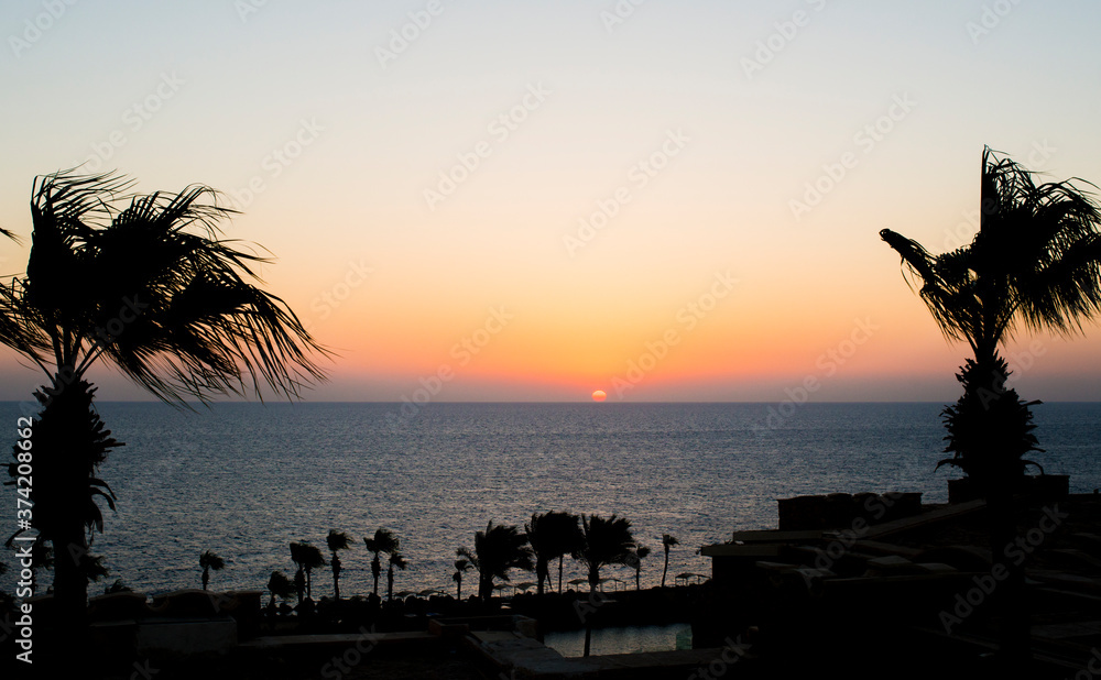 
the sun rises at dawn over the red sea in hurghada