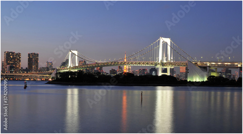 Rainbow bridge in the bay of Tokyo after sunset.