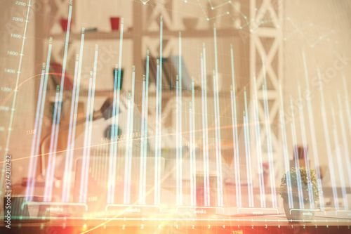 Double exposure of stock market graph drawing and office interior background. Concept of financial analysis.