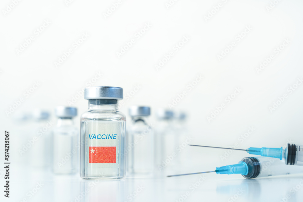 Transparent vials with China flag.Vaccine, syringes for covid-19 coronavirus,flu,infectious diseases.Injection after clinical trials for vaccination of human,child,adult,senior.Medicine, drug concept Transparent vials with China flag.Vaccine, syringes for covid-19 coronavirus,flu,infectious diseases.Injection after clinical trials for vaccination of human,child,adult,senior.Medicine, drug concept