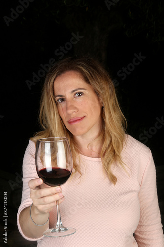 woman with a glass of red wine