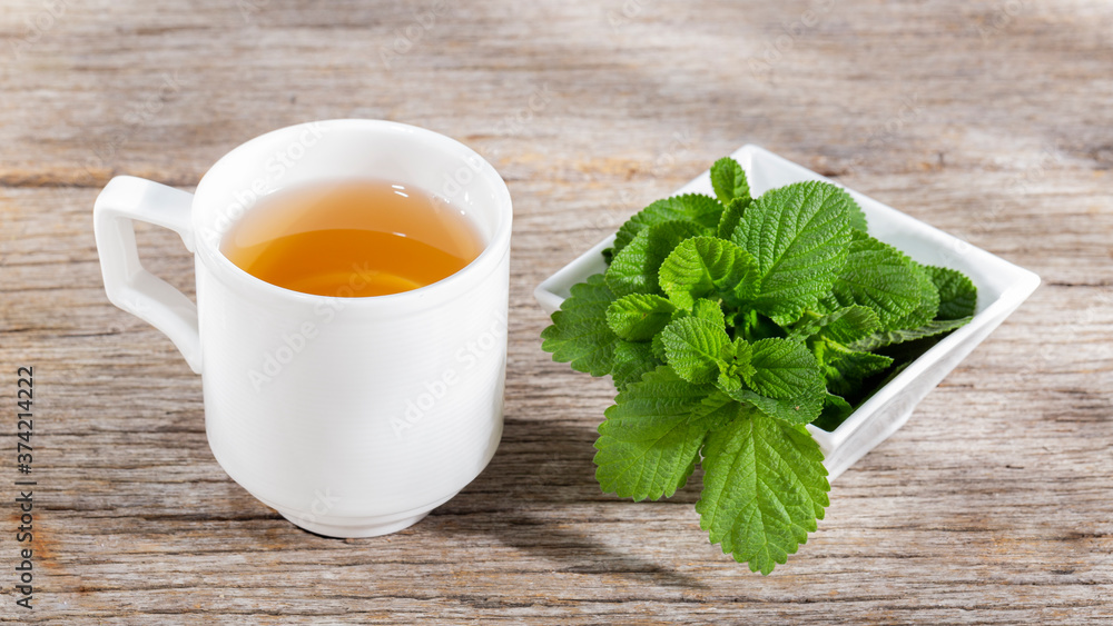 Purple sage plant and tea on the table Purple sage plant and tea on the table