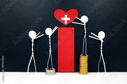 Obraz na płótnie Stick figure reaching for a red heart shape with cross cutout while stepping on stack of coins. Healthcare, medical care and hospital access inequality concept. w salonie