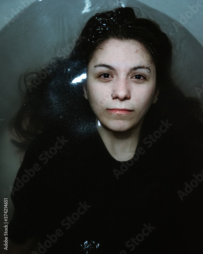 woman in the bathtub concept depression campaign woman advertising emotions photo