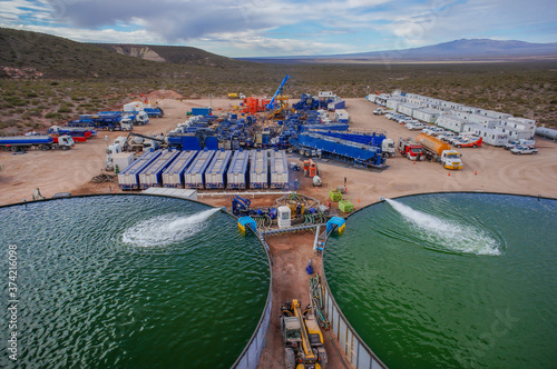 Vaca Muerta, Argentina, November 23, 2015: Extraction of unconventional oil. Water tanks for hydraulic fracturing. photo