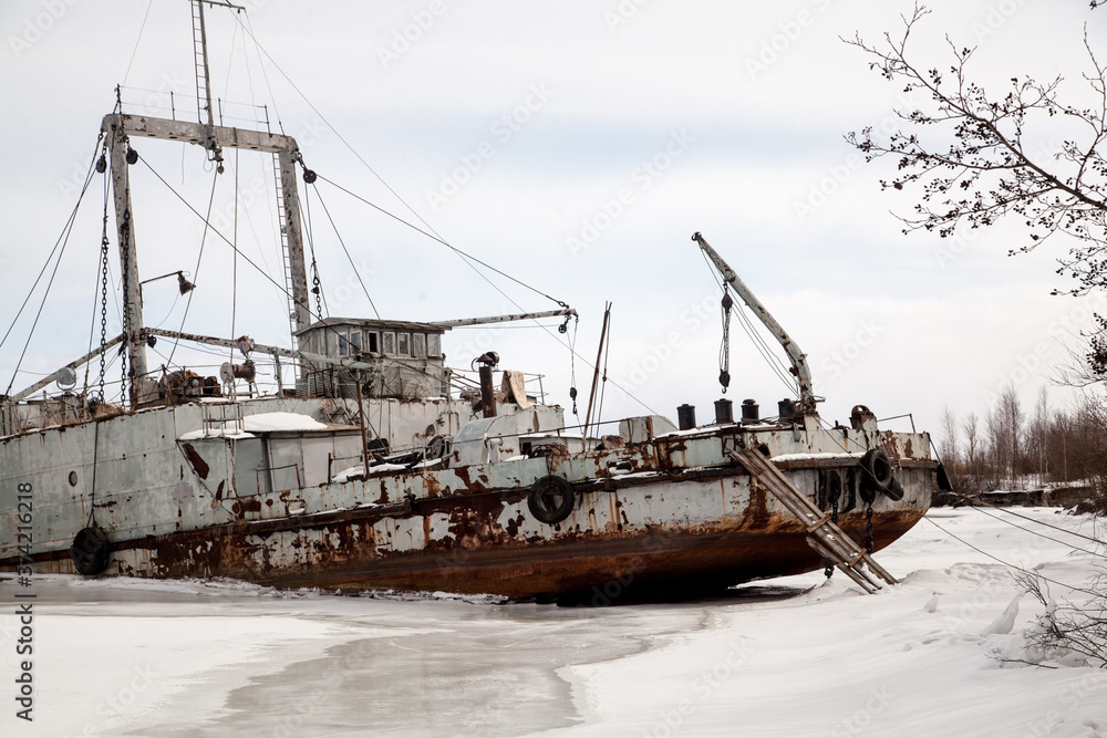 Frozen ship graveyard with two rusty industrial ships Frozen ship graveyard with two rusty industrial ships