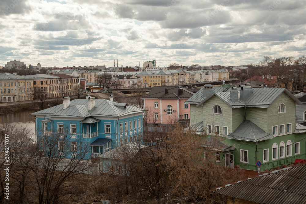 Russian autumn townscape with bright  Cottages