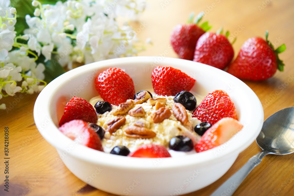 Strawberry yoghurt parfait on wooden table Strawberry yoghurt parfait on wooden table