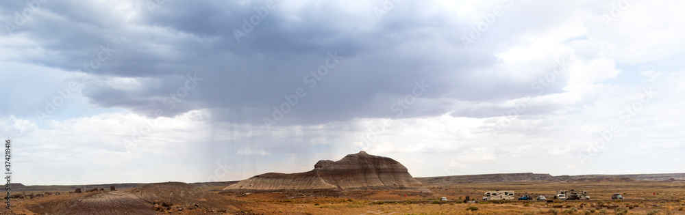 Naklejka premium landscape with clouds and rain and a big storm in the mountains