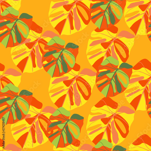 Bright summer exotic seamless pattern with monstera leafs. Orange and green tropical foliage print.