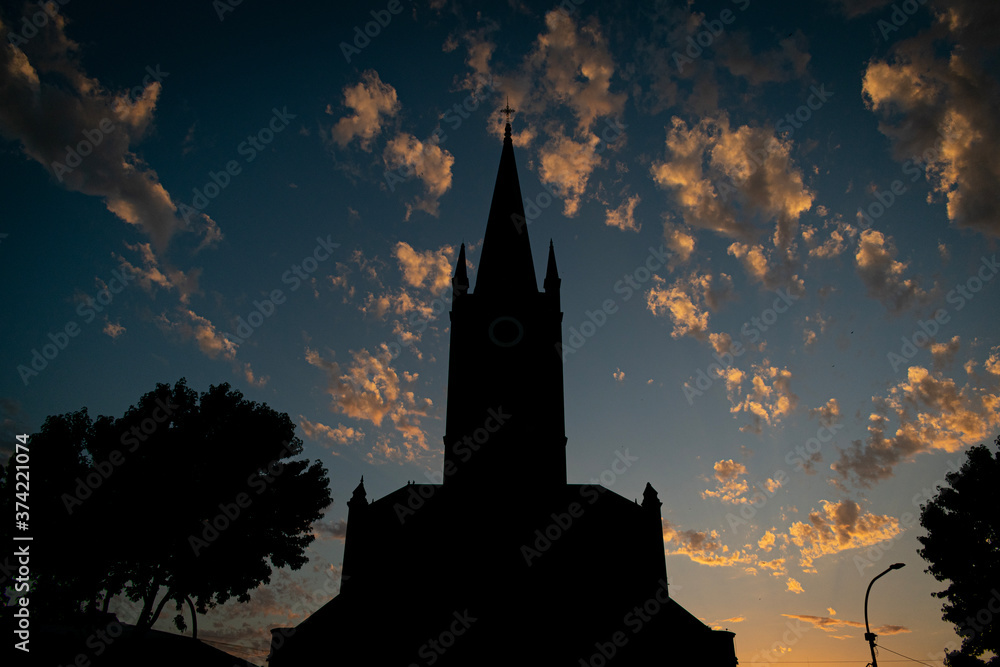 Obraz premium church tower at sunset