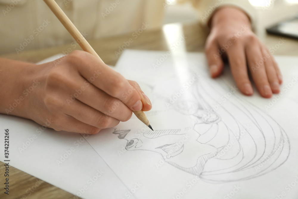 Woman drawing girl's portrait with pencil on sheet of paper at table, closeup Woman drawing girl's portrait with pencil on sheet of paper at table, closeup