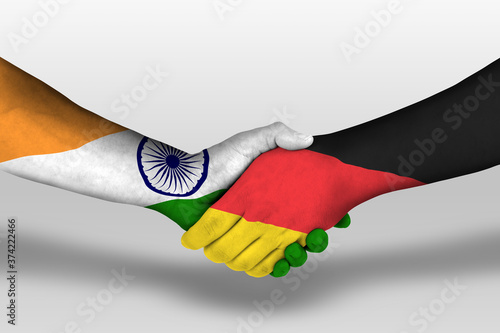 Photography Handshake between germany and india flags painted on hands, illustration with clipping path