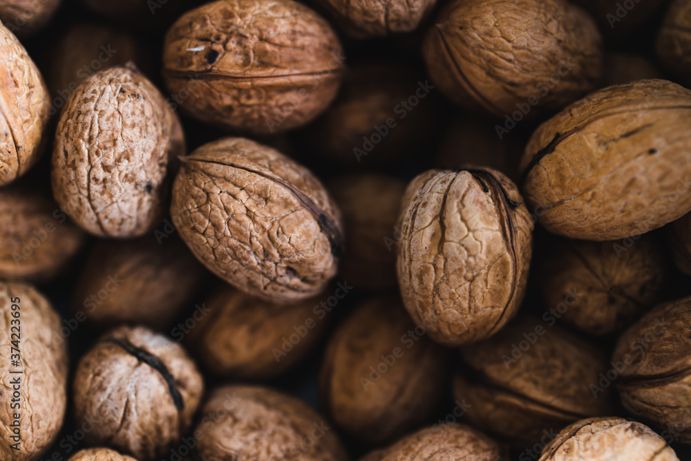 simple food ingredients, bowl of walnuts on kitchen counter simple food ingredients, bowl of walnuts on kitchen counter