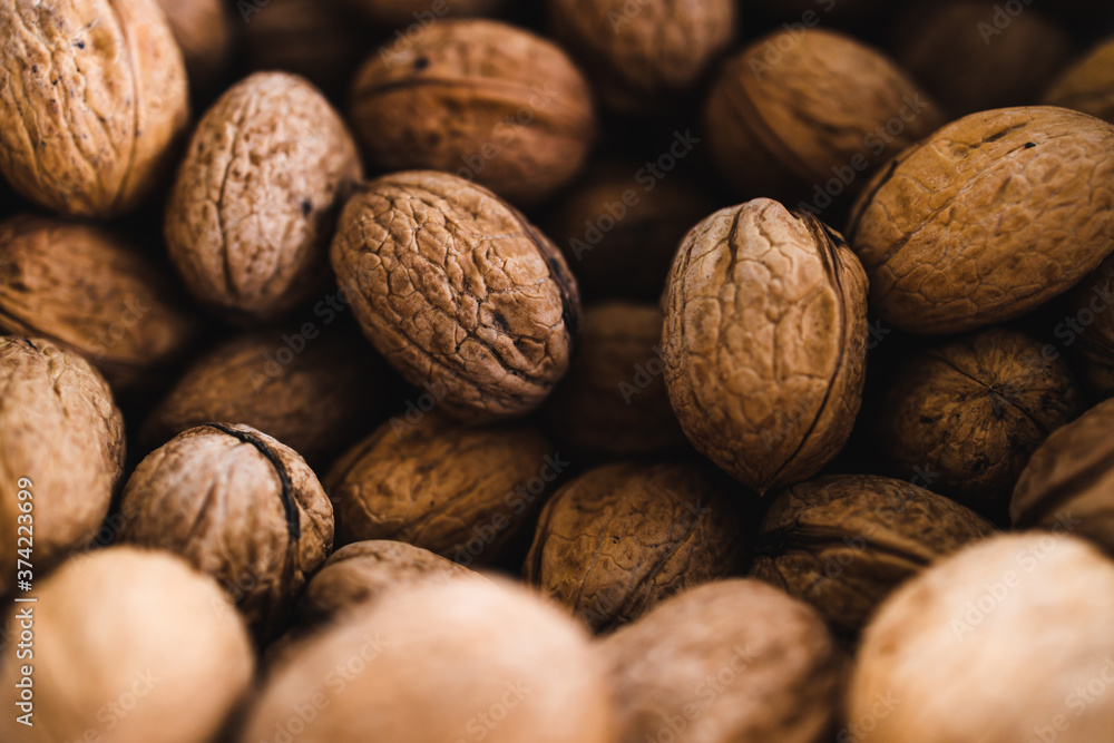 simple food ingredients, bowl of walnuts on kitchen counter simple food ingredients, bowl of walnuts on kitchen counter