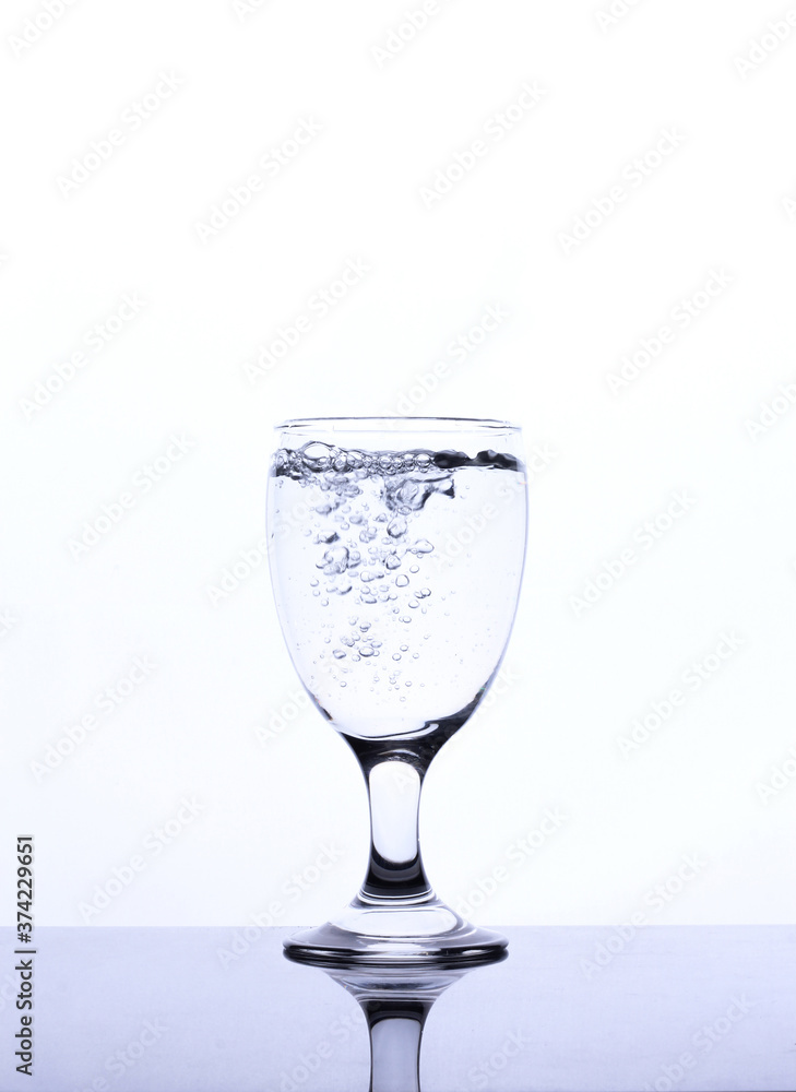 mineral water in a glass isolated white background mineral water in a glass isolated white background