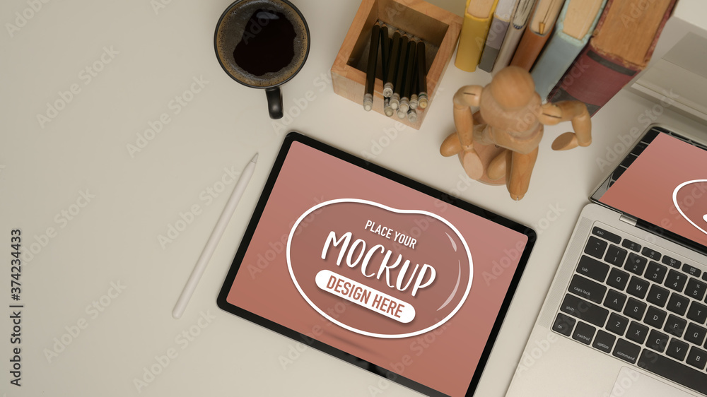 Naklejka premium Study table with mock up tablet, laptop, school elements, coffee mug and decoration