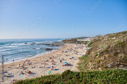 Alentejo beach of almocreve with people on a summer day photo