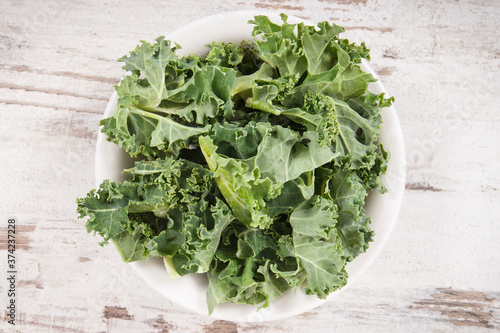 Fresh green curly kale as ingredient of coctail, healthy lifestyles and nutrition concept