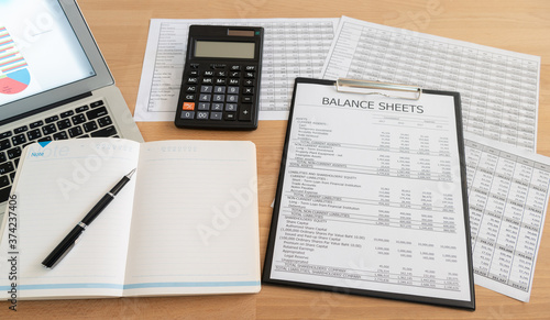 Canvas Print notebook with accounting financial report on accountant desk.