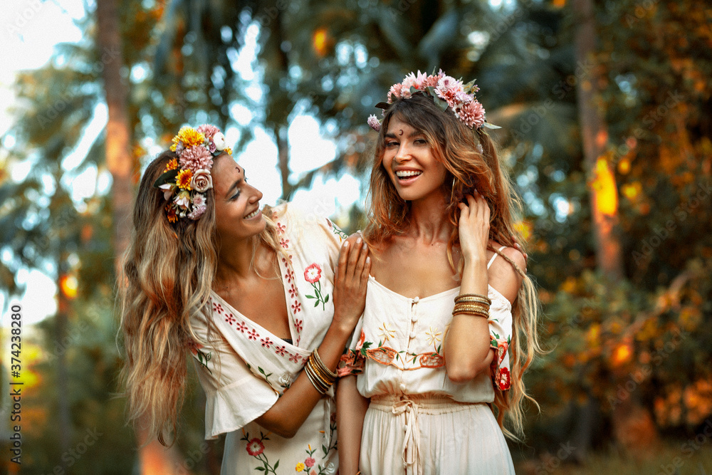 two beautiful young woman in summer dresses outdoors at sunset Stock ...