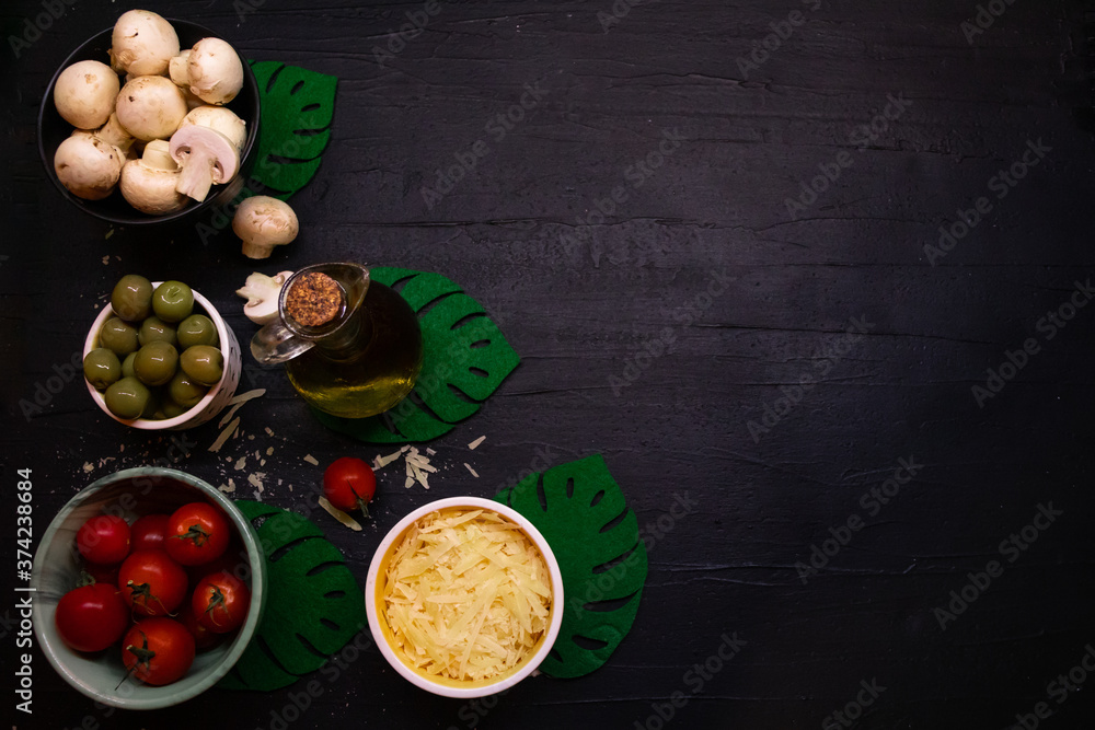 Ingredients for cooking on ablack background. Top view, copy space Ingredients for cooking on ablack background. Top view, copy space