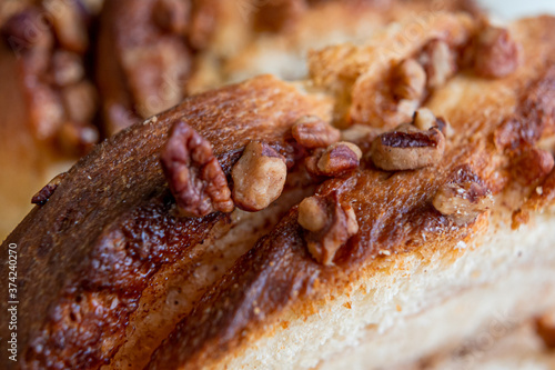 Delicious homemade walnut bread with sliced       walnuts pieces in close up.