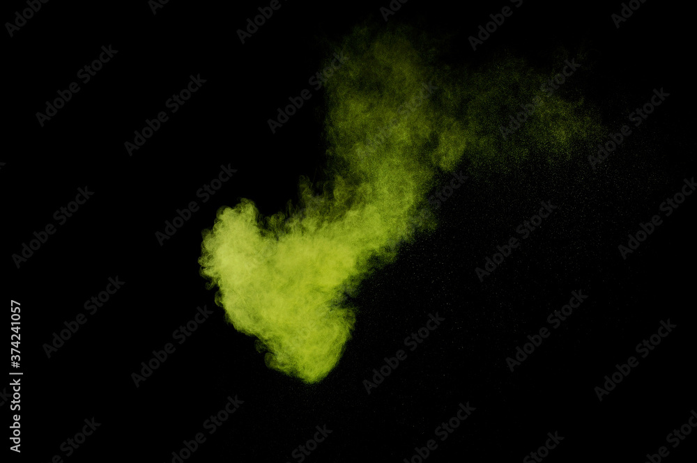 Light green powder explosion on black background. Colored powder cloud. Colorful dust explode. Paint  Holi.