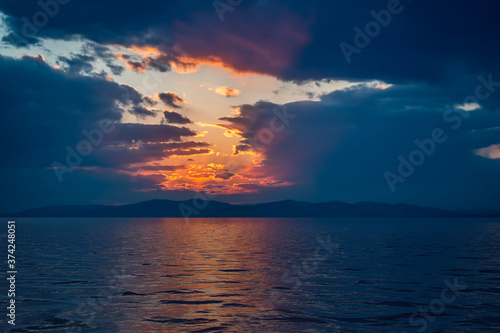 Seascape with a dark dramatic sunset