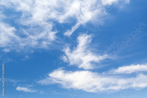 White altocumulus clouds over deep blue sky at daytime