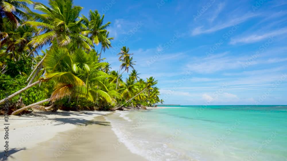 Cuba palm beach landscape. Beach and sea on summer sunny day. Clear turquoise seawater washes over a clean sandy beach. Nobody copy space. Cuba palm beach landscape. Beach and sea on summer sunny day. Clear turquoise seawater washes over a clean sandy beach. Nobody copy space.