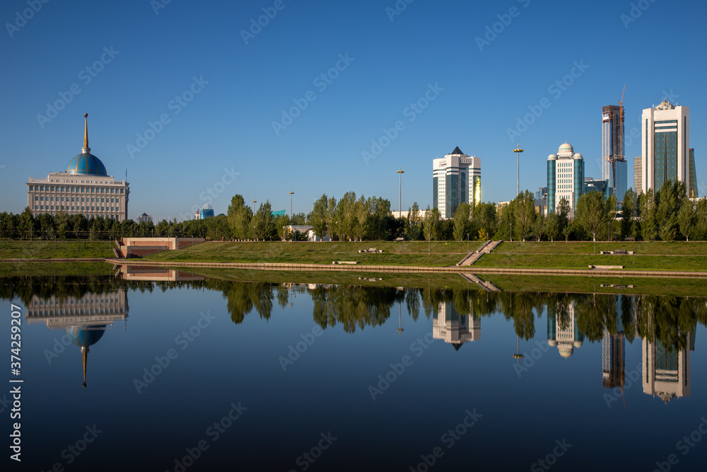 View from the right embankment of Ishim river facing the Ak Orda Presidential Palace in Nur-Sultan, the capital of Kazakhstan.