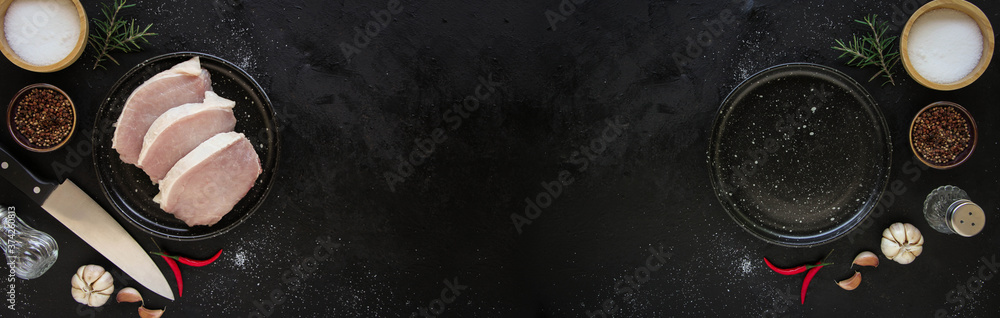 Cut raw beef with spices in plate and Empty plate on a dark metal background. Top view with copy space. Cut raw beef with spices in plate and Empty plate on a dark metal background. Top view with copy space.