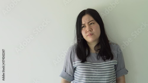 Sad worried young asia woman attractive face having psychological problem feeling anxiety depression, upset frustrated lonely lady thinking of grief troubled with unwanted pregnancy concept
