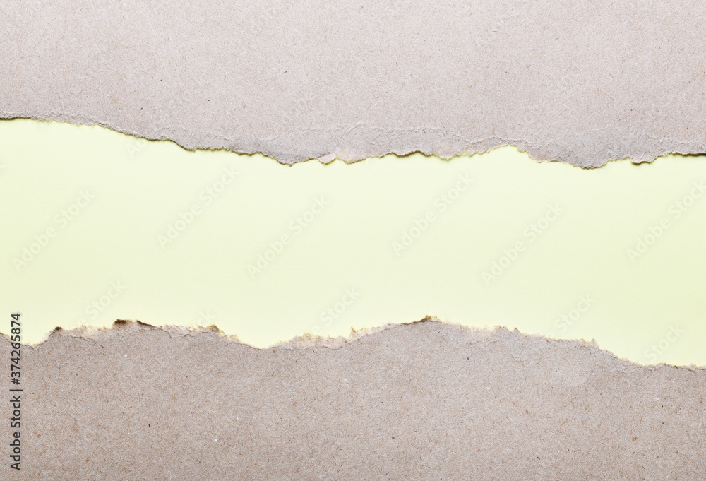 Dark paper with torn edges on a light green background of colored paper inside. Good paper texture Dark paper with torn edges on a light green background of colored paper inside. Good paper texture