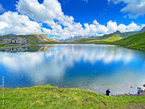 Fishermens on the artificial alpine lake Melchsee or Melch lake in the Uri Alps mountain massif, Melchtal - Canton of Obwald, Switzerland (Kanton Obwalden, Schweiz) photo