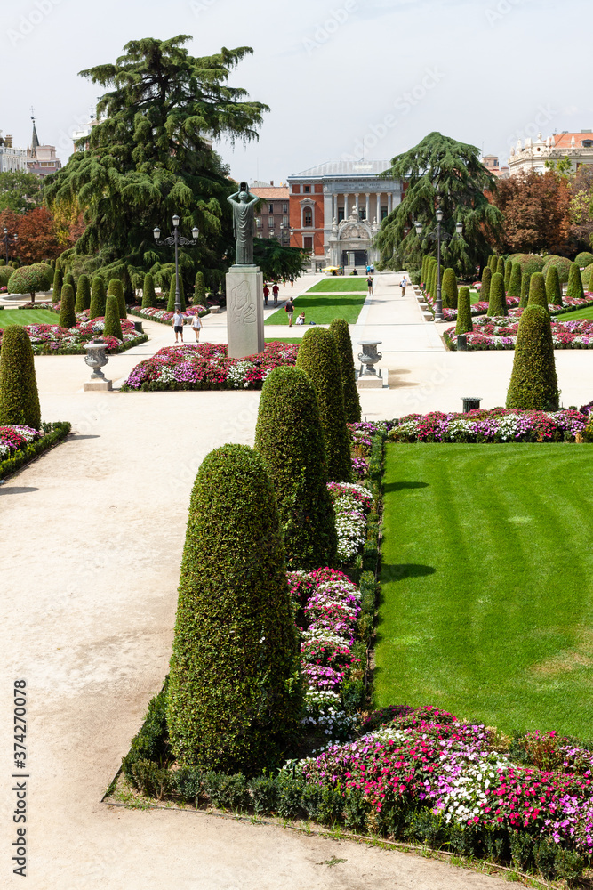 Beautiful Park with a lot of green trees and bushes in Madrid, Span in September during the sunny day