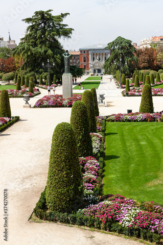  Beautiful Park with a lot of green trees and bushes in Madrid, Span in September during the sunny day