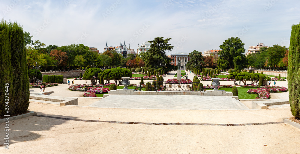 Beautiful Park with a lot of green trees and bushes in Madrid, Span in September during the sunny day