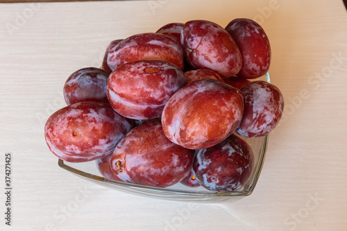 Ripe delicious juicy plums closeup.