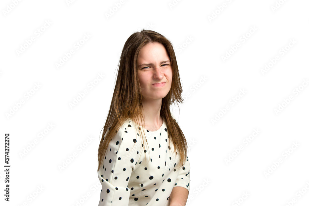 A young woman with long brown hair and a white polka-dot dress. A young woman with long brown hair and a white polka-dot dress.
