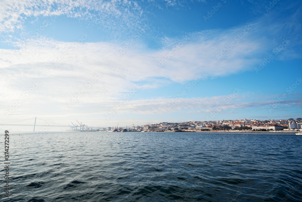 Tagus river in Lisbon. View on Bridge and city shore.