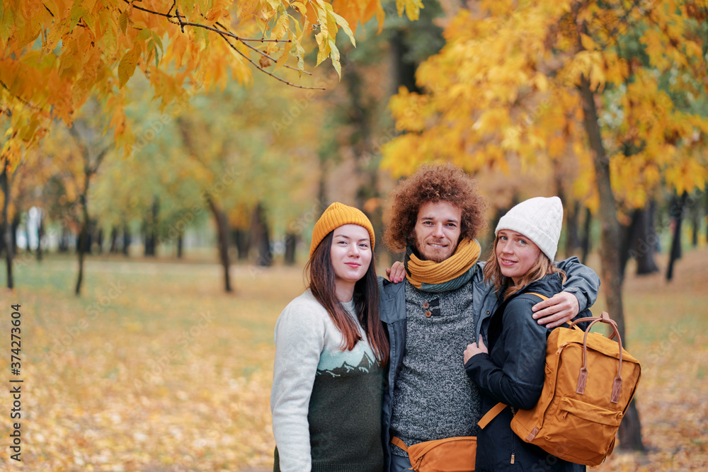 Holidays with friends. Group of young people walking together in the park. Holidays with friends. Group of young people walking together in the park.